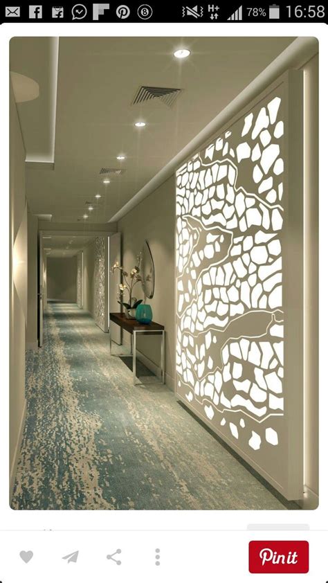 long hallway  white walls  light blue carpeting   floor