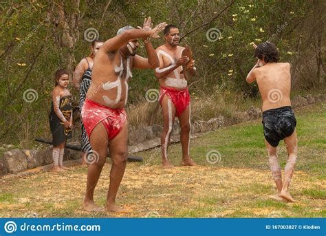 3 aboriginal men dance in circle on grass in newcastle