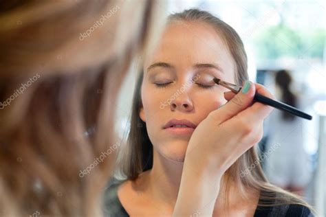 beautician applying eye   stock photo  simplefoto