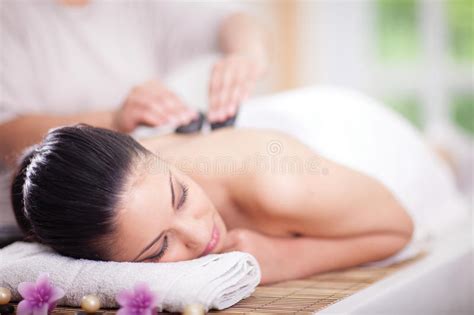 beautiful woman having a wellness back massage at spa