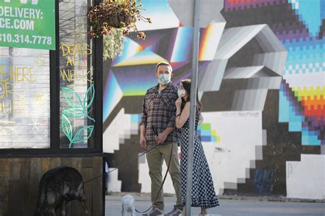 ana de armas and ben affleck on a walk wearing a face mask