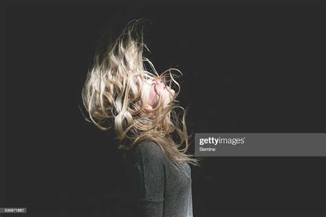 blonde female with hair over face stock foto getty images