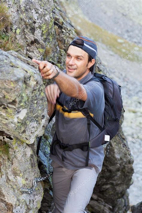 young man hiking  difficult mountain trail stock photo  xalanx