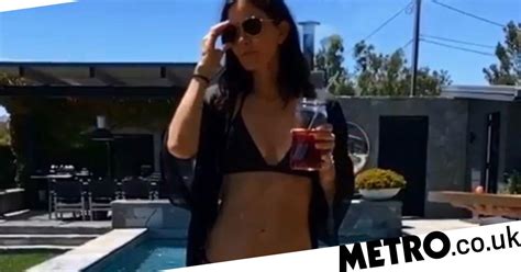 Courteney Cox Takes A Dip In Her Pool With The Help Of