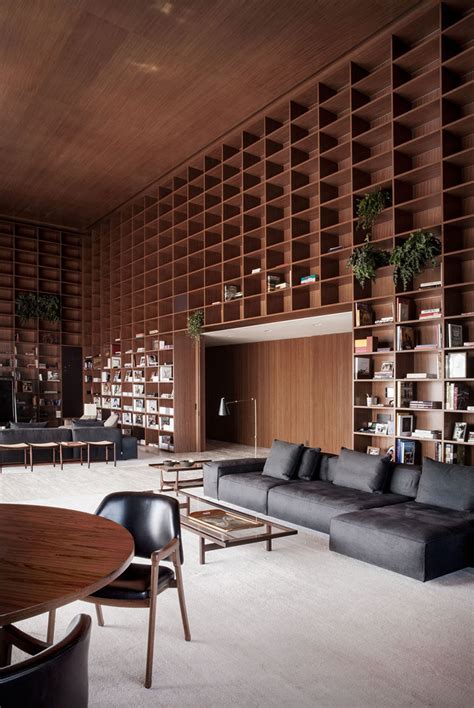 studio mk design  double height room  floor  ceiling wooden shelves