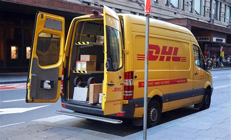 yellow dhl car parked  sydney cbd area express courier delivery  mail parcels  documents