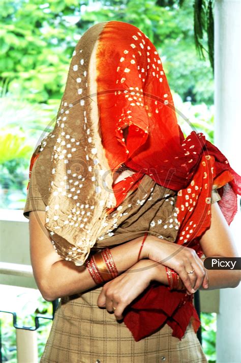 Image Of Indian Woman With Her Face Covered With Scarf Bd613916 Picxy