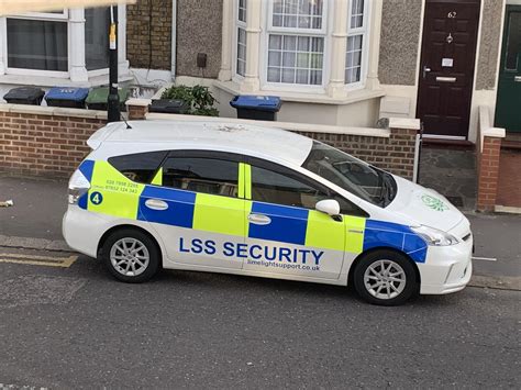 uk    legal  security company   battenburg patterns   police car  uk
