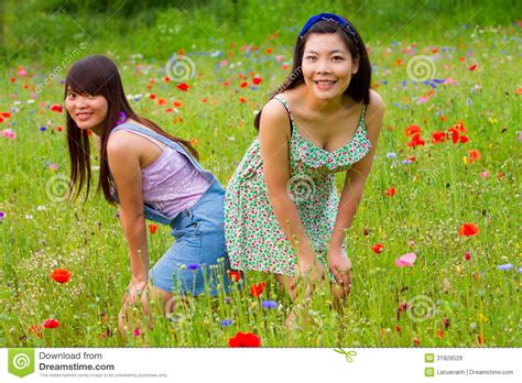 Girls Pose Picture In Poppy Flower Field Royalty Free