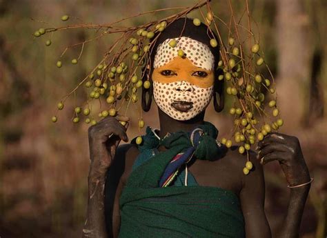 portrait of beautiful surma girl taken in the soft light of sunrise