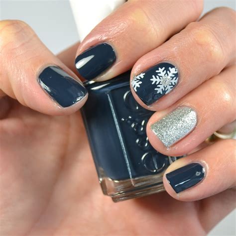polished navy  silver snowflake nail design