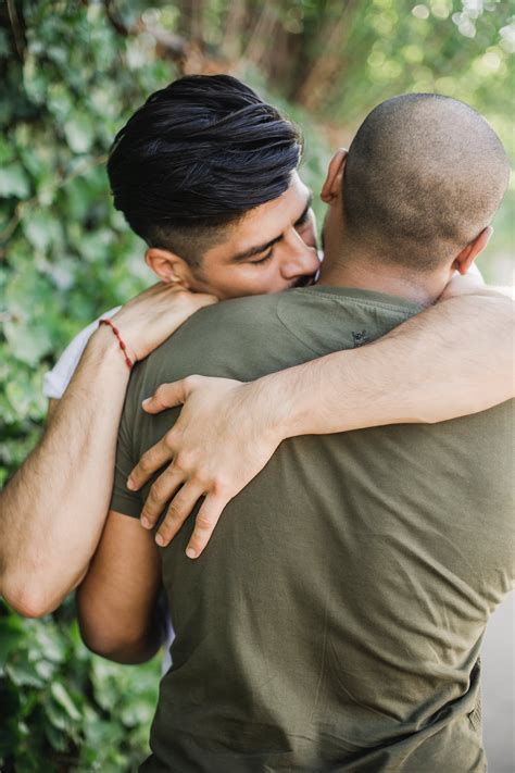 men hugging  stock photo