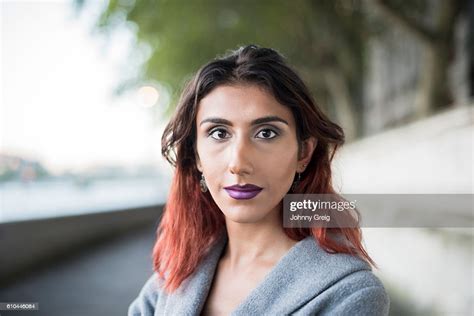 portrait of transgender female looking towards camera bildbanksbilder