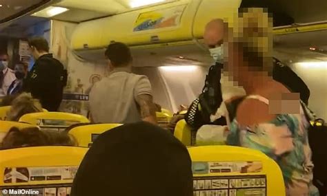 moment police haul rude ryanair passenger off flight from portugal