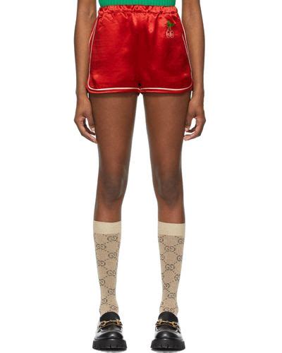 gucci satin gg cherry shorts in red lyst
