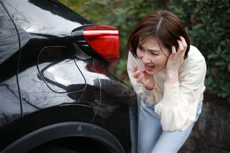 female checking for car scratches stock image image of journey