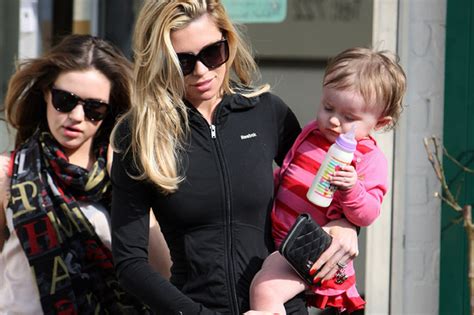 Abbey Clancy Leaves A Beauty Salon With Her Naiils Painted