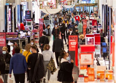 black friday  crowds    sales surge  long lines  persist