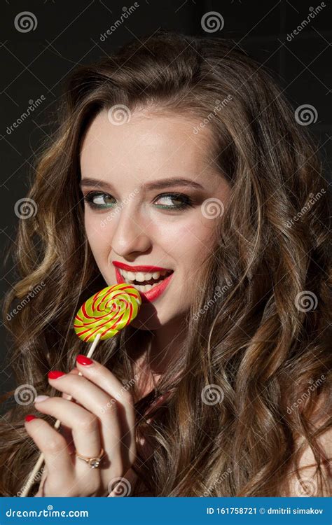 beautiful woman eats a big candy sweet lollipop stock image image of
