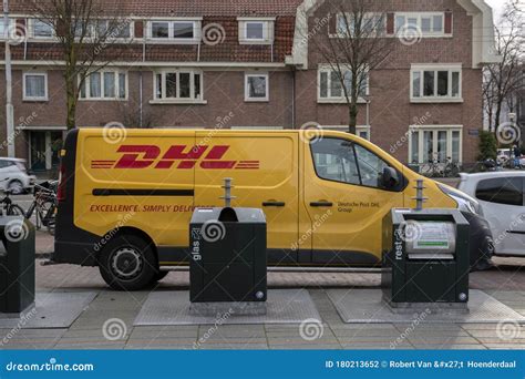 dhl company car standing   amsterdam  netherlands  editorial photography image