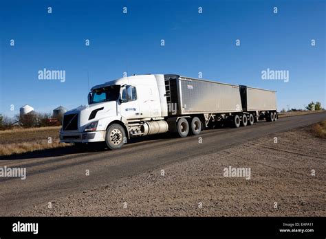 semi truck towing double trailer  highway  rural saskatchewan canada stock photo alamy