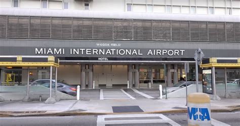 man threatens  blow miami airport  ak grenade  suicide