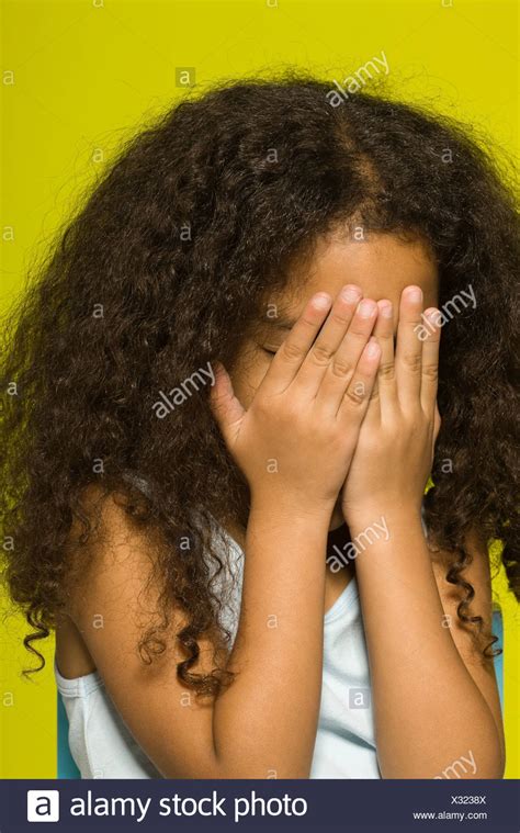 hands covering face black girl child high resolution stock photography  images alamy