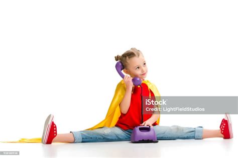 Happy Supergirl Sitting On Split And Talking On Phone Isolated On White