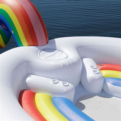 this rainbow unicorn pool float fits six people is where