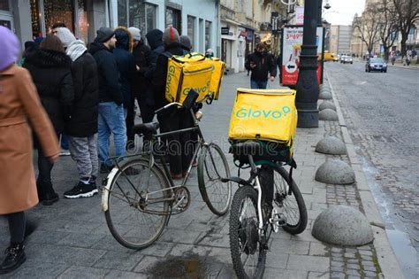Glovo Delivery Couriers Are Waiting For Pizza To Take Home To Their