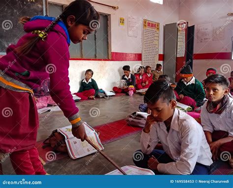 indian village school girl teaching  stick  classroom  india