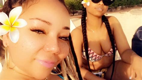 tiny harris jamaica pics bikini photo shows tons of cleavage hollywood life