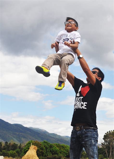 man carrying boy  stock photo