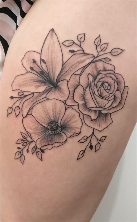delicate  feminine whip shaded flower tattoo   thigh  tiny