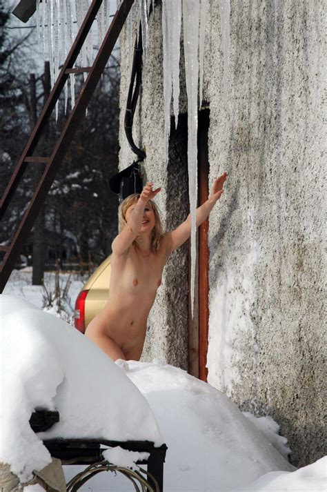 a smiling blonde touches a huge icicle russian sexy girls