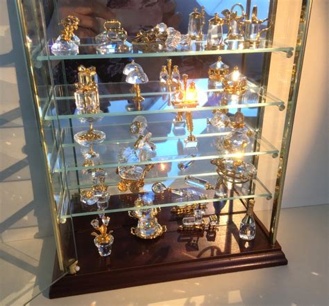 swarovski display cabinet  swarovski figures  crt gold  crystal catawiki