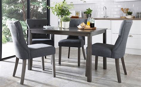 milton grey wood dining table   bewley slate fabric chairs