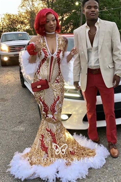 gold with red sequin with white feather mermaid african american prom
