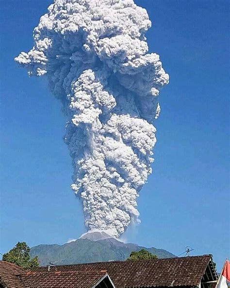 merapi volcano erupts sending plume  ash  km   feet  sea level  indonesia