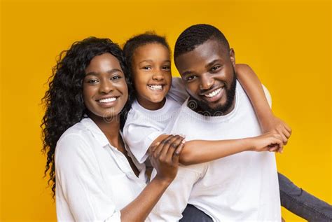 portrait  positive black family   stock photo image  parents father