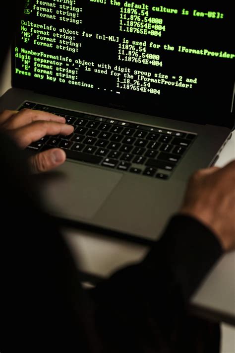 crop hacker typing  laptop  data  screen  stock photo