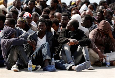 migrant crisis continues as hundreds of refugees in just two boats land in italy world news