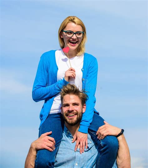 Man Carries Girlfriend On Shoulders Sky Background Romantic Date