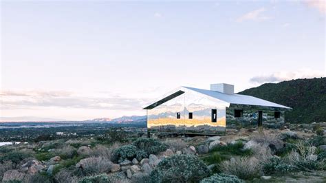doug aitken installs entirely mirrored cabin in the