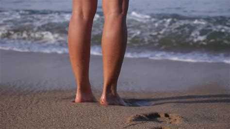 female leg stand   beach   ocean stock footage video
