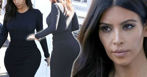 kim kardashian shows off her hourglass figure in black dress and that bum looks curvier than