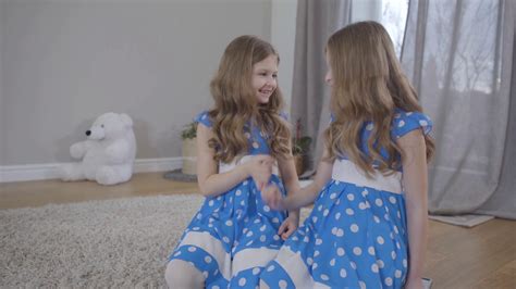 Two Twin Sisters In Elegant Blue Dotted Stock Footage Sbv 338137363