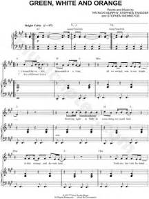 gaelic storm green white and orange sheet music in a