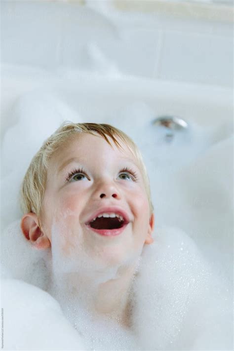 happy child   bubble bath  stocksy contributor raymond