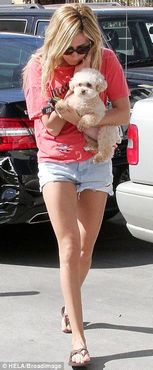 ashley tisdale parades her toned and tanned legs in daisy dukes as she